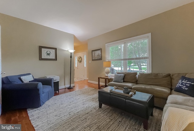 21143 Catnip Ct, Leonardtown, MD 20650 - living room featuring baseboards, wood finished floors, and lofted ceiling