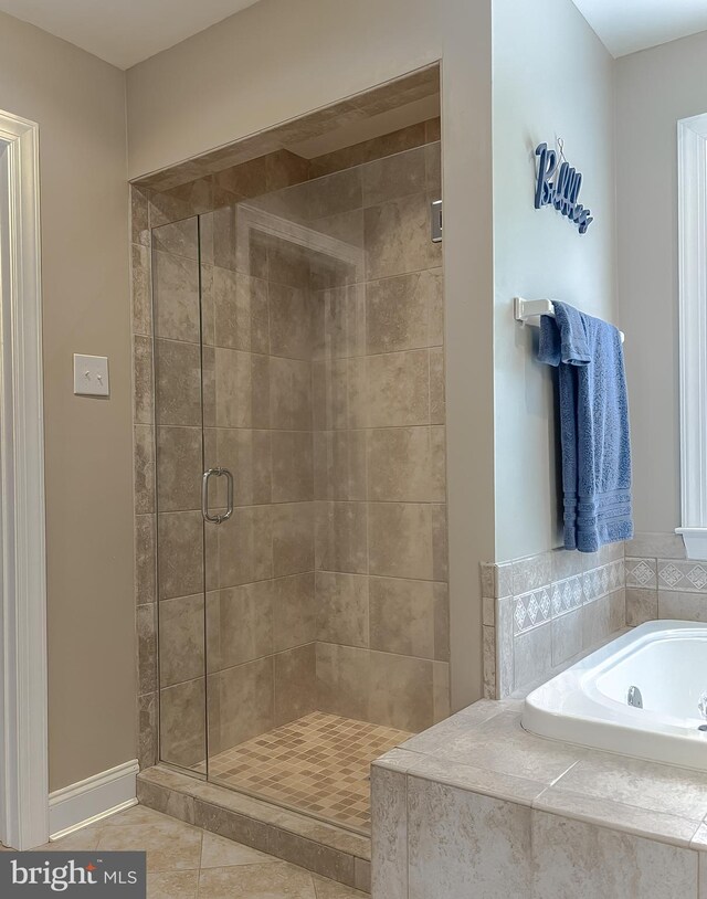 21143 Catnip Ct, Leonardtown, MD 20650 - full bath with a shower stall, a bath, tile patterned flooring, and baseboards