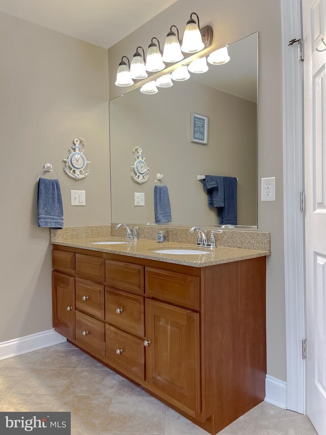 21143 Catnip Ct, Leonardtown, MD 20650 - bathroom featuring double vanity, baseboards, and tile patterned floors