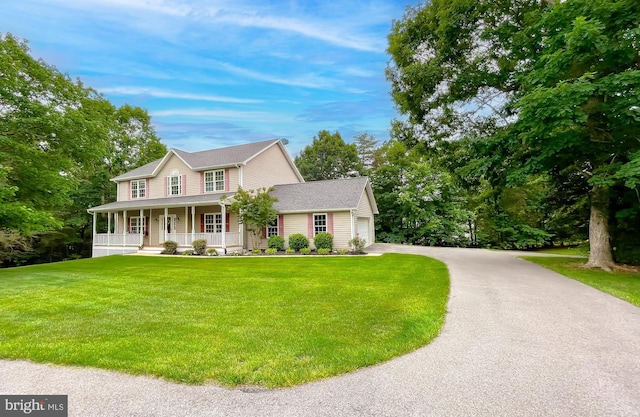 21143 Catnip Ct, Leonardtown, MD 20650 - view of front of property featuring covered porch, a front yard, an attached garage, asphalt driveway, and roof with shingles