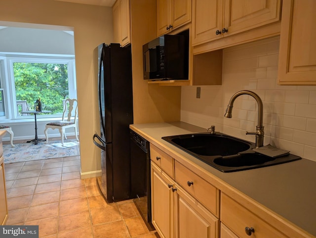 9510 Clement Rd, Silver Spring, MD 20910 - kitchen with black appliances, a sink, decorative backsplash, light countertops, and baseboards