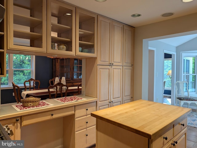 9510 Clement Rd, Silver Spring, MD 20910 - kitchen with butcher block counters, plenty of natural light, glass insert cabinets, and recessed lighting