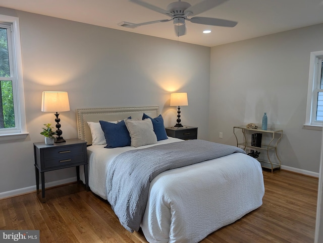 9510 Clement Rd, Silver Spring, MD 20910 - bedroom featuring multiple windows, wood finished floors, baseboards, and recessed lighting