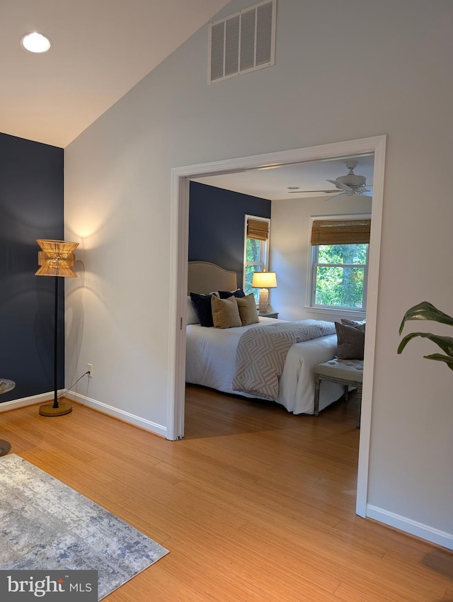 9510 Clement Rd, Silver Spring, MD 20910 - bedroom featuring baseboards, wood finished floors, and vaulted ceiling