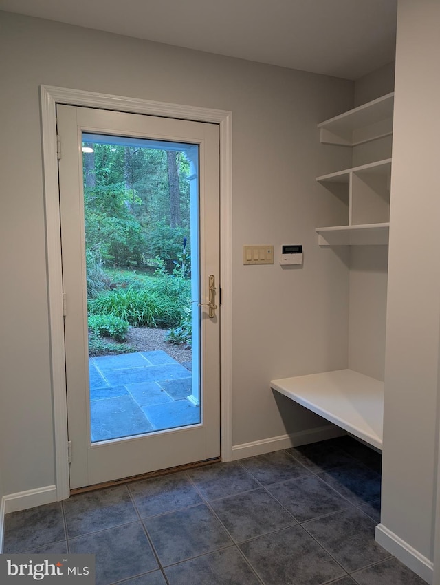 9510 Clement Rd, Silver Spring, MD 20910 - doorway to outside featuring baseboards and dark tile patterned flooring