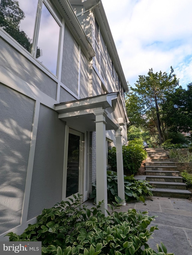 9510 Clement Rd, Silver Spring, MD 20910 - view of home's exterior featuring stairs and stucco siding