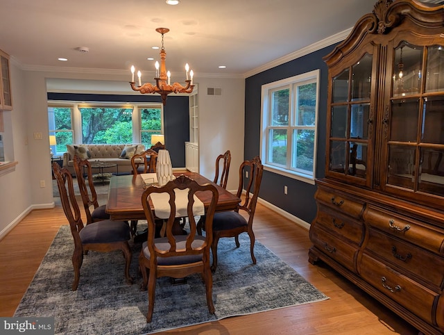 9510 Clement Rd, Silver Spring, MD 20910 - dining space with a chandelier, light wood-style flooring, baseboards, recessed lighting, and crown molding