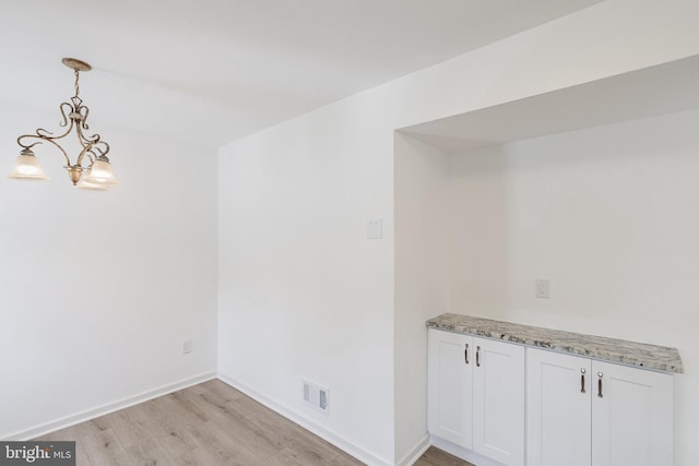 11 Rivercrest, Little Egg Harbor Twp, NJ 08087 - unfurnished dining area featuring light wood-style floors, a chandelier, and baseboards