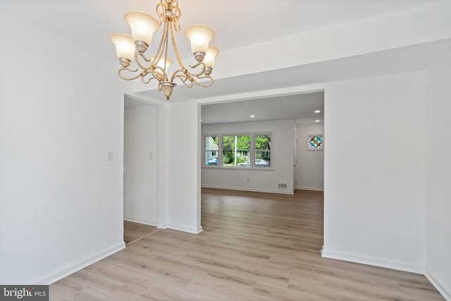 11 Rivercrest, Little Egg Harbor Twp, NJ 08087 - empty room with a chandelier, light wood-style flooring, and baseboards