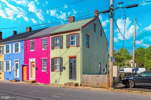 15 Degrange St, Frederick, MD 21701 - townhome / multi-family property with a chimney and brick siding