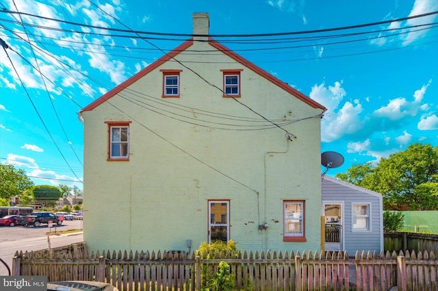 15 Degrange St, Frederick, MD 21701 - rear view of property featuring a chimney