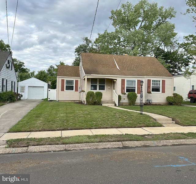 120 Lindsey Ave, Runnemede, NJ 08078 - view of front of house featuring concrete driveway, a front yard, an outbuilding, and a garage