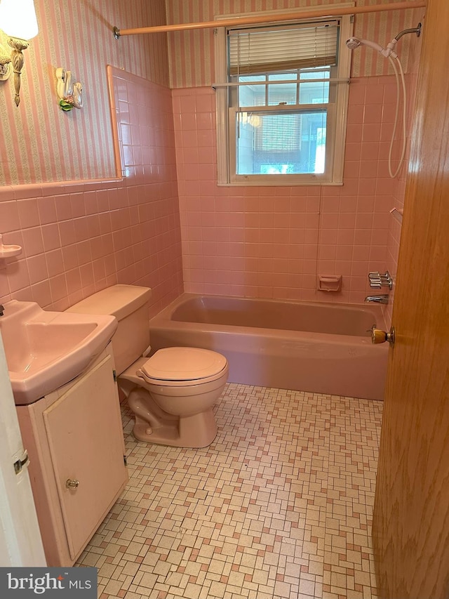 120 Lindsey Ave, Runnemede, NJ 08078 - full bath featuring wallpapered walls, tile walls, toilet, vanity, and shower / tub combination