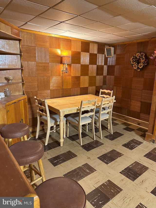 120 Lindsey Ave, Runnemede, NJ 08078 - dining room with tile patterned floors and wood walls