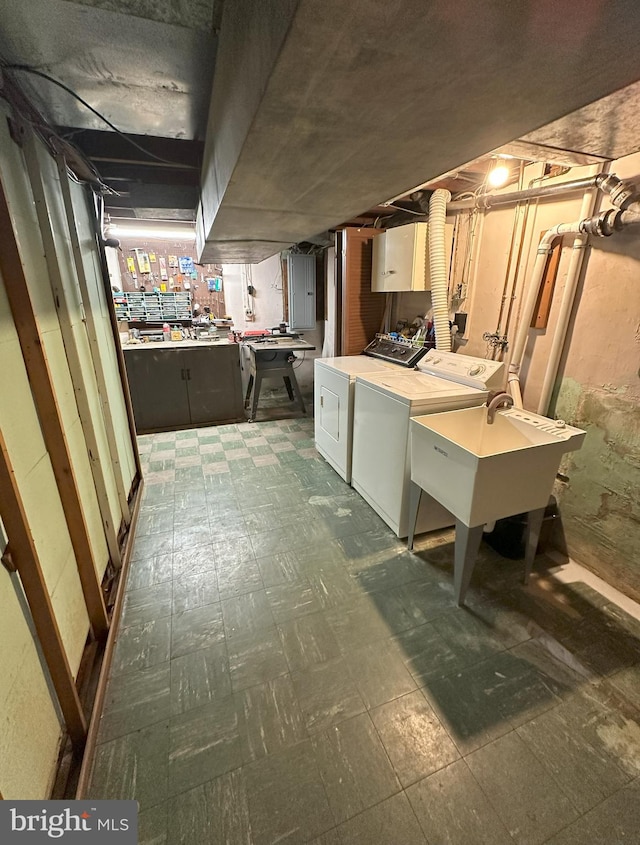 120 Lindsey Ave, Runnemede, NJ 08078 - basement with washer and dryer, dark floors, and a sink