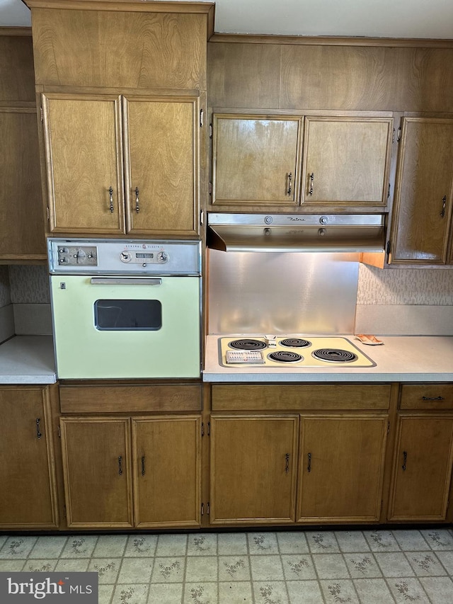 120 Lindsey Ave, Runnemede, NJ 08078 - kitchen with white appliances, under cabinet range hood, and light countertops