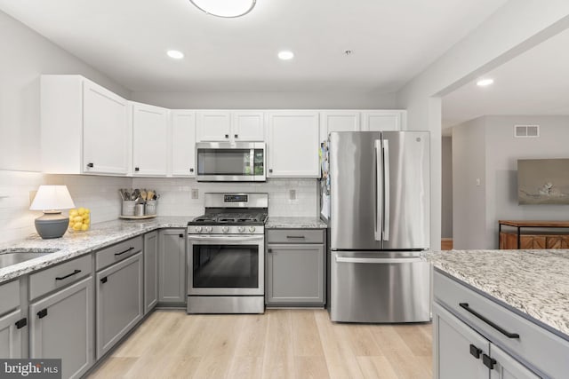 440 Glenn Rose Cir, King Of Prussia, PA 19406 - kitchen with stainless steel appliances, gray cabinetry, light wood-style flooring, tasteful backsplash, and recessed lighting