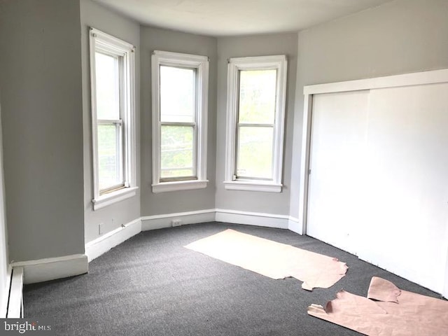 1364 Park Blvd, Camden, NJ 08103 - unfurnished bedroom with dark colored carpet, baseboards, and a closet