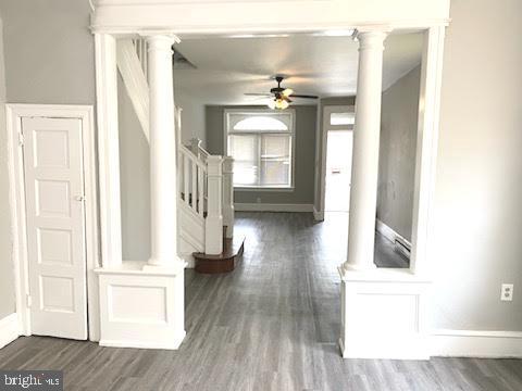 1364 Park Blvd, Camden, NJ 08103 - hall with ornate columns, wood finished floors, and baseboards