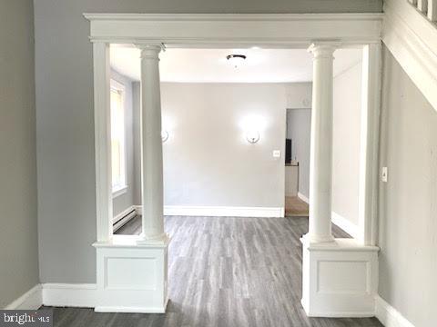 1364 Park Blvd, Camden, NJ 08103 - corridor with wood finished floors, baseboards, and a baseboard heating unit