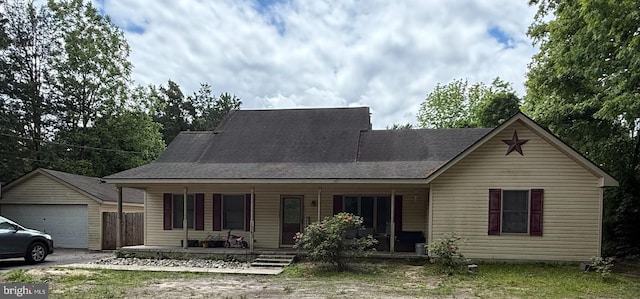 1243 Garry Ave, Vineland, NJ 08361 - view of front of property featuring covered porch, a detached garage, and an outdoor structure