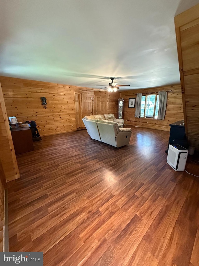 1243 Garry Ave, Vineland, NJ 08361 - living area with wood finished floors, ceiling fan, and wood walls