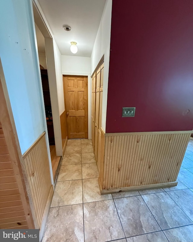 1243 Garry Ave, Vineland, NJ 08361 - hall featuring wainscoting, wooden walls, and light tile patterned flooring