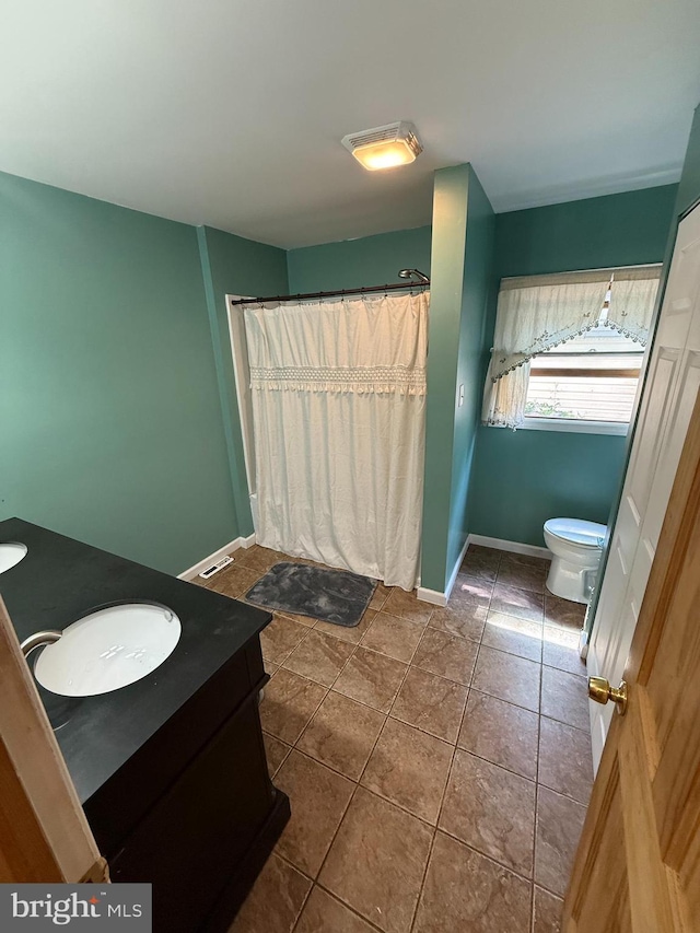 1243 Garry Ave, Vineland, NJ 08361 - full bath with vanity, toilet, tile patterned flooring, and baseboards