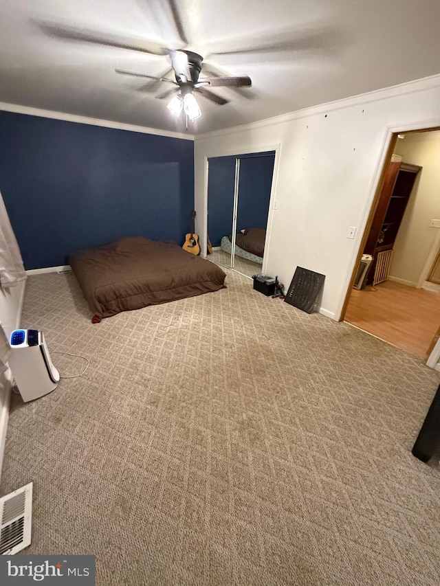 1243 Garry Ave, Vineland, NJ 08361 - bedroom featuring carpet flooring, crown molding, a closet, baseboards, and ceiling fan