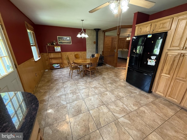 1243 Garry Ave, Vineland, NJ 08361 - dining space with wainscoting, ceiling fan, a chandelier, wooden walls, and light tile patterned floors