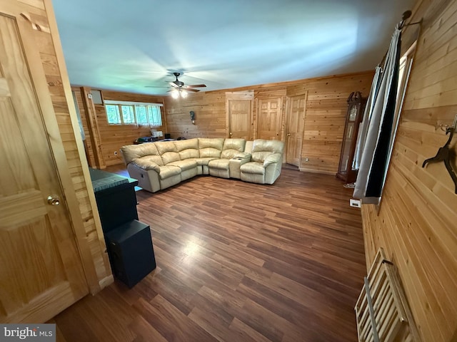 1243 Garry Ave, Vineland, NJ 08361 - living room featuring wood walls, ceiling fan, and dark wood finished floors