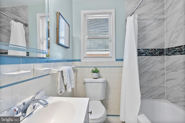 5421 Omaha Ave, Baltimore, MD 21206 - full bath featuring toilet, tile walls, shower / tub combo, a wainscoted wall, and vanity