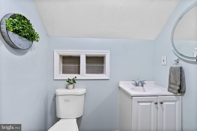 5421 Omaha Ave, Baltimore, MD 21206 - half bath featuring vaulted ceiling, toilet, vanity, and a textured ceiling