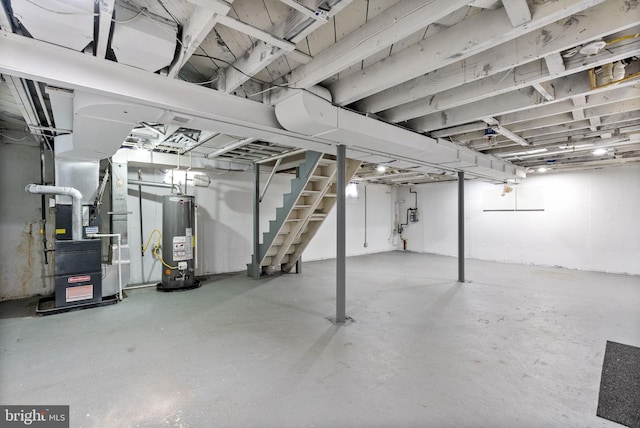 5421 Omaha Ave, Baltimore, MD 21206 - unfinished below grade area featuring gas water heater, stairs, and heating unit