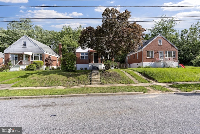 5421 Omaha Ave, Baltimore, MD 21206 - bungalow-style house with brick siding, a front lawn, and driveway