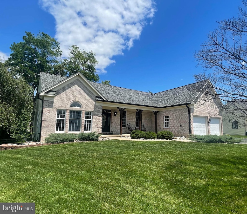 5810 Underwood Ct, Adamstown, MD 21710 - ranch-style house featuring brick siding, a porch, a front yard, and an attached garage