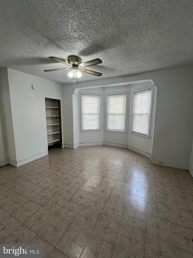 3639 N Darien St, Philadelphia, PA 19140 - unfurnished room featuring a textured ceiling, a ceiling fan, and baseboards
