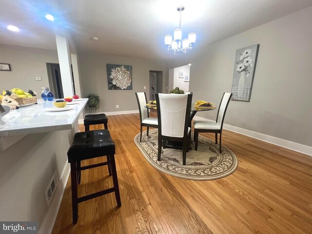 3701 Lochearn Dr, Gwynn Oak, MD 21207 - dining room with light wood-style floors, a chandelier, baseboards, and recessed lighting
