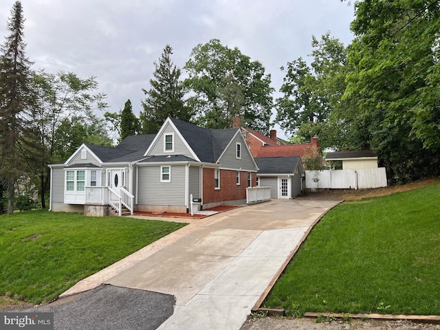 3701 Lochearn Dr, Gwynn Oak, MD 21207 - view of front of property with concrete driveway, a chimney, and brick siding