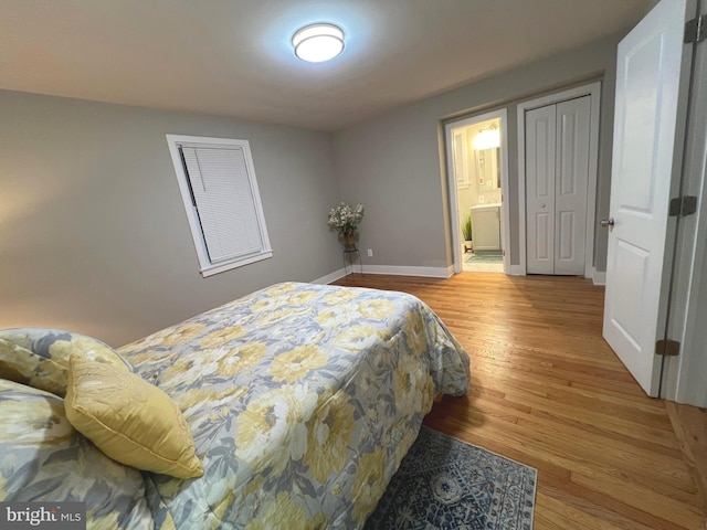 3701 Lochearn Dr, Gwynn Oak, MD 21207 - bedroom with wood finished floors, baseboards, and ensuite bathroom
