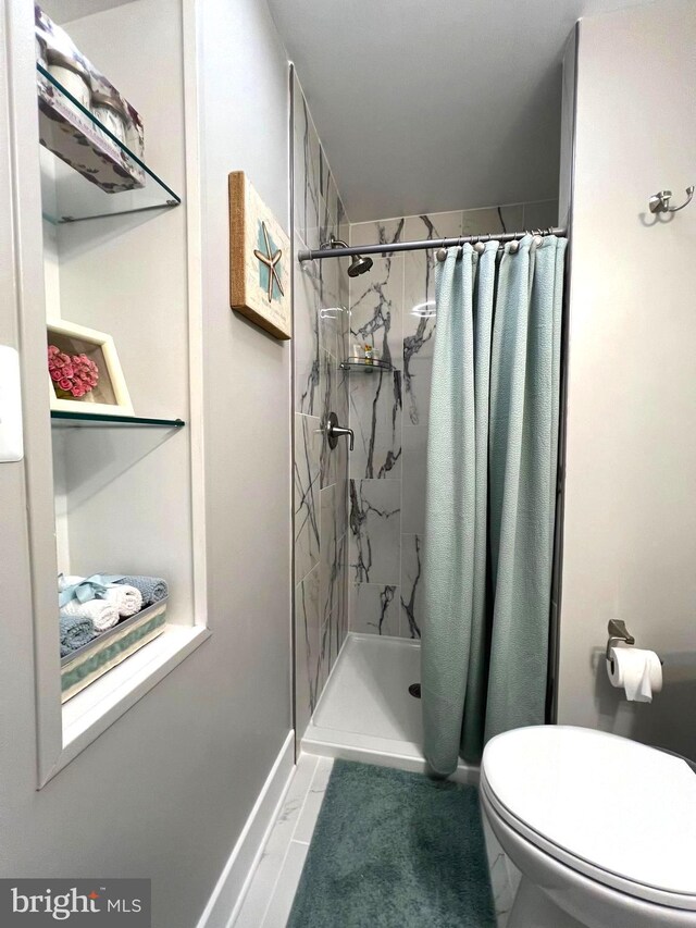 3701 Lochearn Dr, Gwynn Oak, MD 21207 - full bathroom featuring a stall shower and toilet