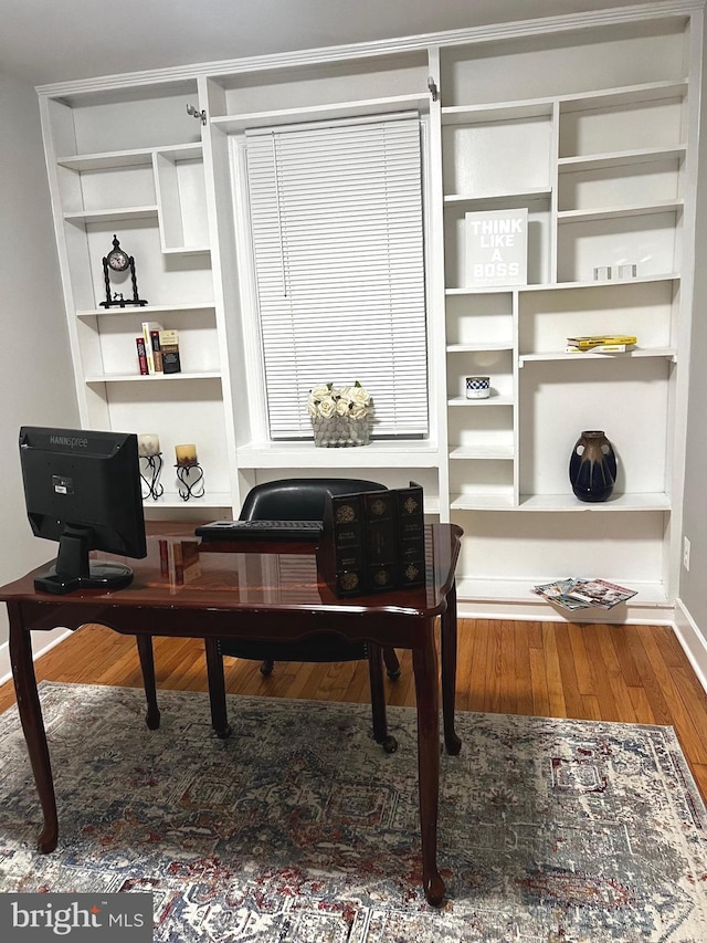 3701 Lochearn Dr, Gwynn Oak, MD 21207 - sitting room with wood finished floors, baseboards, and built in shelves