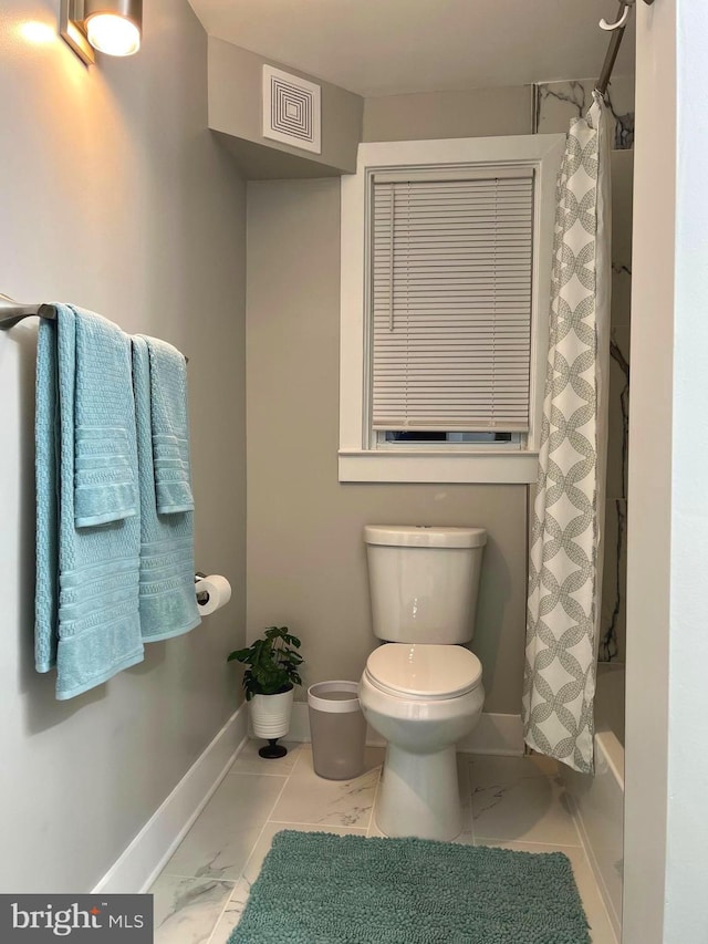 3701 Lochearn Dr, Gwynn Oak, MD 21207 - full bathroom featuring toilet, marble look tile flooring, baseboards, and shower / bath combo with shower curtain