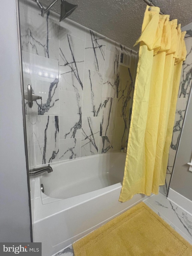 3701 Lochearn Dr, Gwynn Oak, MD 21207 - bathroom with shower / tub combo with curtain and marble look tiles