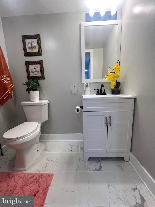 3701 Lochearn Dr, Gwynn Oak, MD 21207 - half bathroom featuring baseboards, marble finish floors, vanity, and toilet