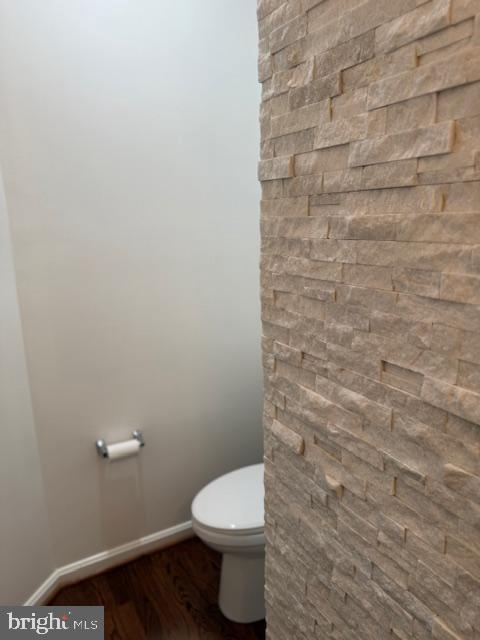 2307 Brooke Grove Rd, Bowie, MD 20721 - bathroom featuring toilet, wood finished floors, and baseboards