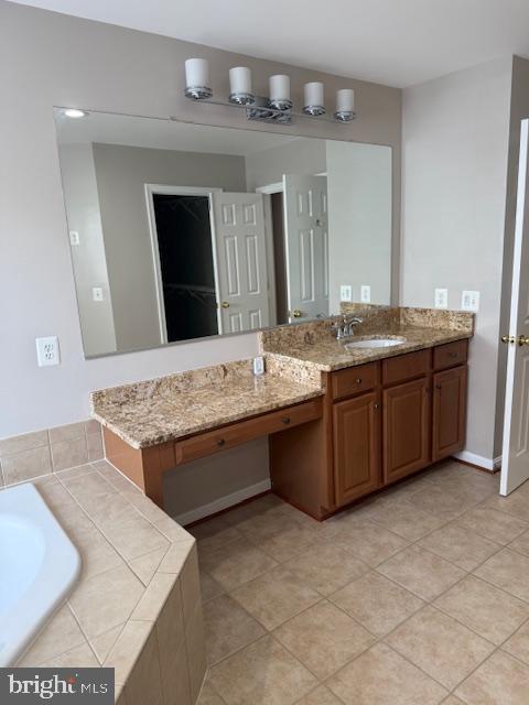 2307 Brooke Grove Rd, Bowie, MD 20721 - bathroom featuring vanity, a garden tub, and tile patterned flooring
