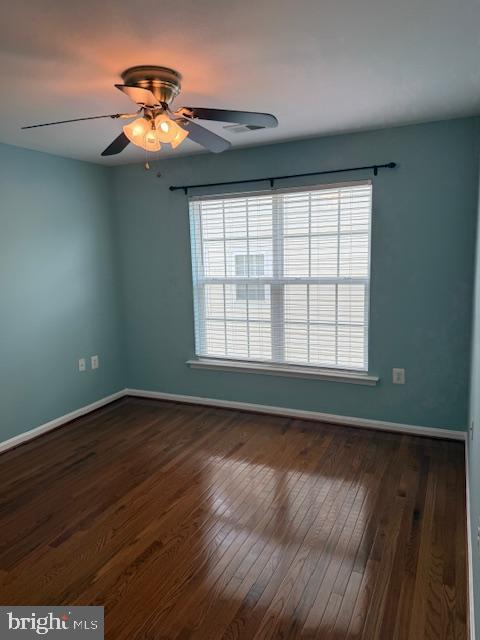 2307 Brooke Grove Rd, Bowie, MD 20721 - unfurnished room with healthy amount of natural light, baseboards, hardwood / wood-style flooring, and a ceiling fan