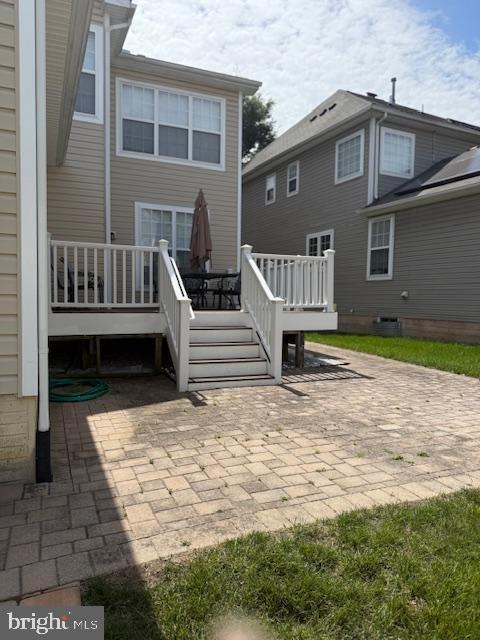 2307 Brooke Grove Rd, Bowie, MD 20721 - back of house featuring a deck and a patio area