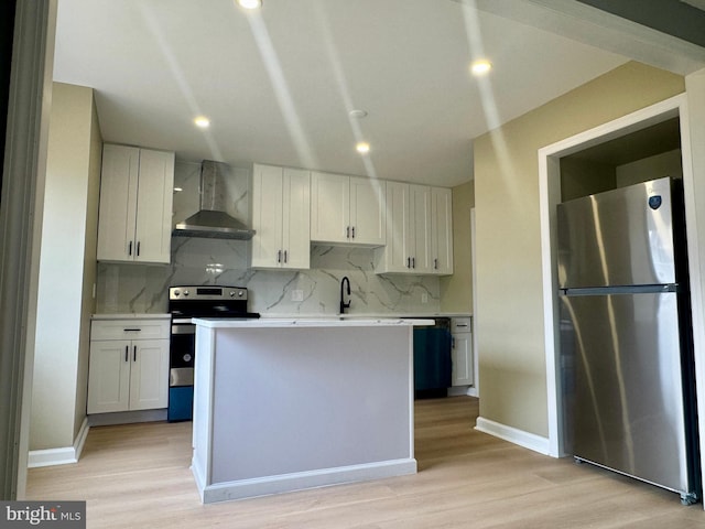 3627 Longridge Ct, Abingdon, MD 21009 - kitchen featuring stainless steel appliances, wall chimney range hood, light wood-style floors, tasteful backsplash, and recessed lighting